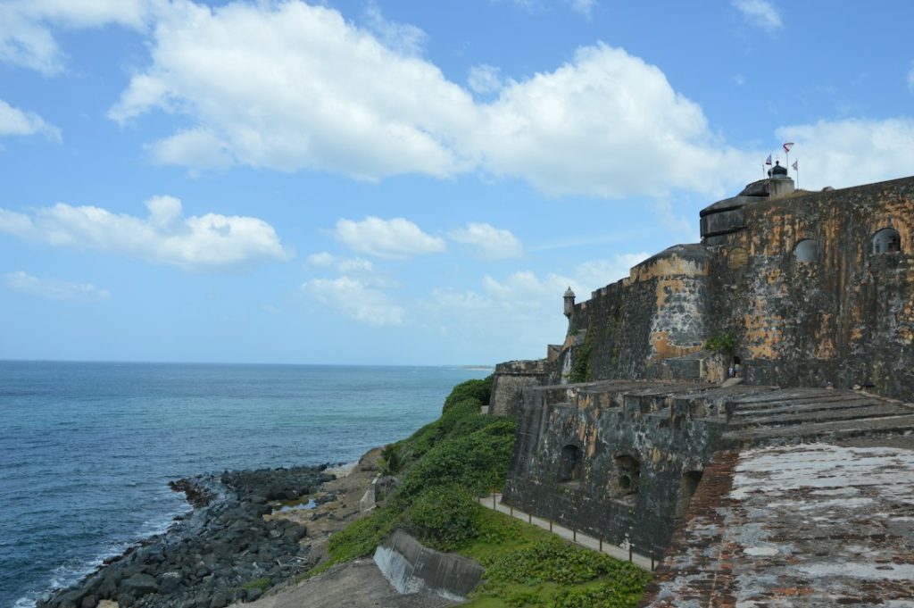 A historic stone fortification wall beside the water