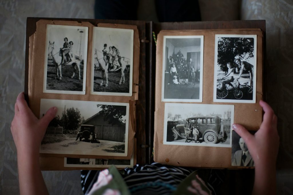 Family members looking through a collection of old photographs